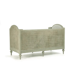 Light green outdoor Winni Daybed by Zentique with cushioned seating and wooden frame, perfect for relaxing outdoors.