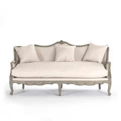 A beige Adele Sofa Jute by Zentique featuring a cushioned seat and wooden legs, showcasing a stylish and comfortable sofa design.