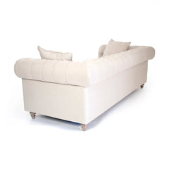 Alaine sofa by Zentique featuring plush upholstered cushions and elegant wooden legs in a stylish living room setting.