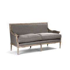 Louis sofa by Zentique featuring elegant upholstery, classic design, and plush cushions in a stylish living room setting.