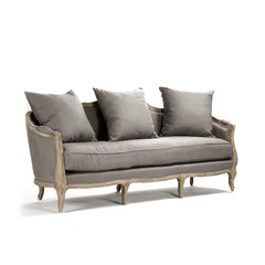 Maison three-seat sofa by Zentique featuring plush upholstery and elegant wooden legs, showcasing a stylish and comfortable living room piece.