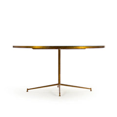 Elegant Caine table by Zentique featuring a sleek wooden top and sturdy metal legs, ideal for modern living spaces.