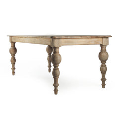 Felicia dining table by Zentique featuring a wooden tabletop with elegant carved legs for a sophisticated dining space.