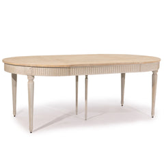 Martel dining table by Zentique featuring a wooden surface and elegant design for modern dining spaces.