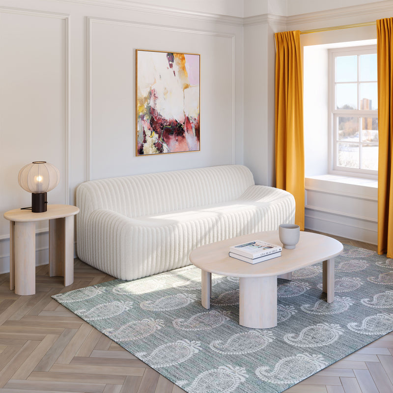 Cream Osterbro sofa by Zuo Modern, featuring plush upholstery and modern design, shown in a stylish living room setting.